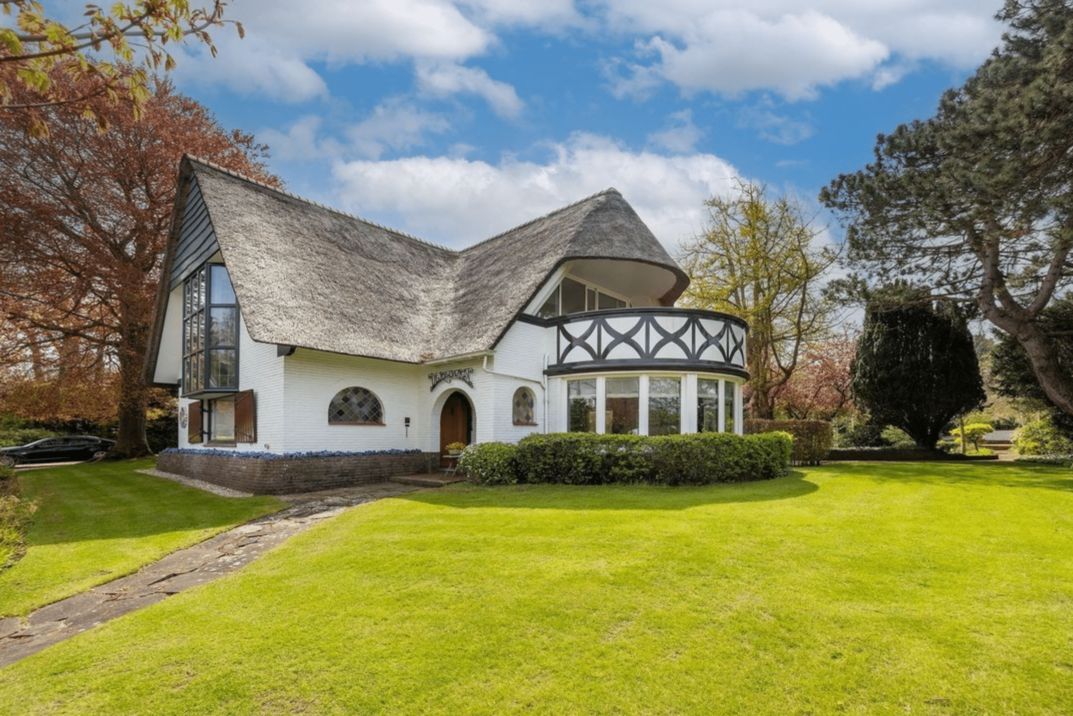 thatched home for sale